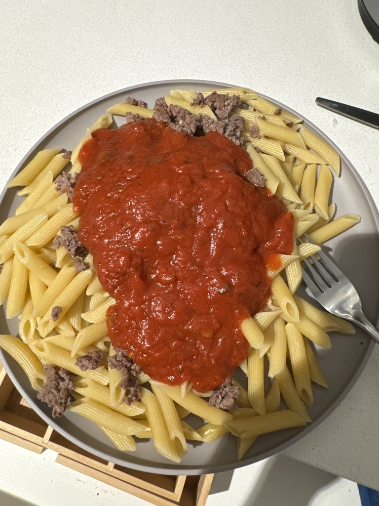 Red sauce pasta with meat and mushroom